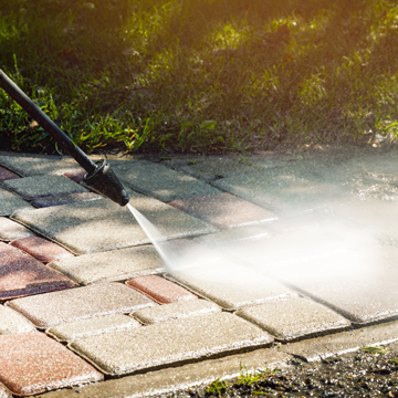 pressure washer cleaning patio stones outdoor maintenance